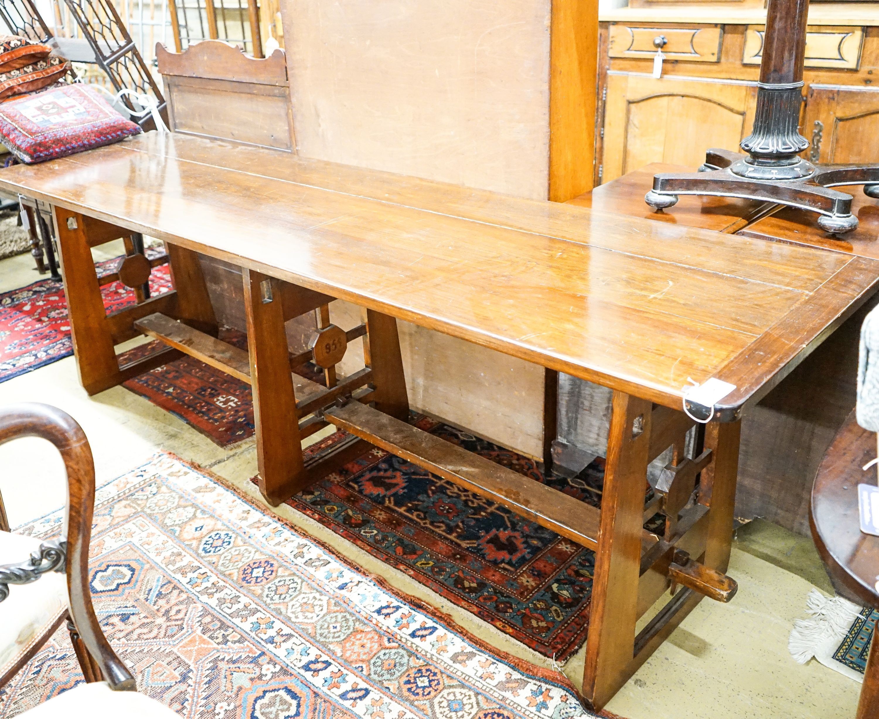 A mid 20th century Arts and Crafts style rectangular pine and beech serving table, dated 1955, length 245cm, depth 66cm, height 76cm